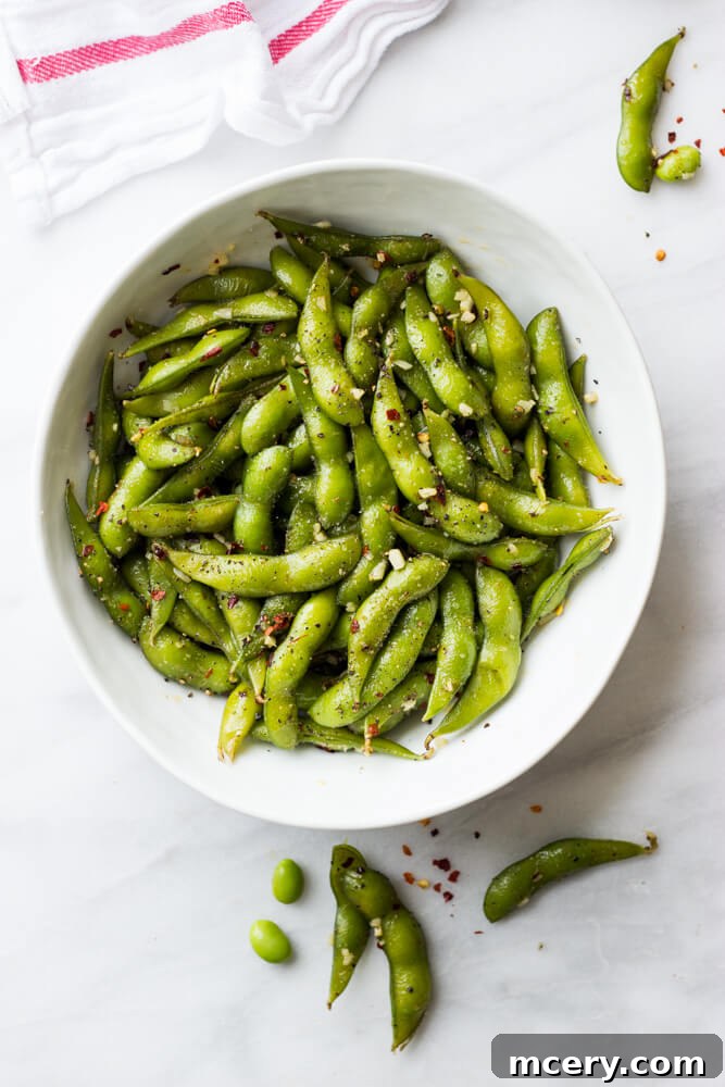 Fiery Garlic Edamame 2 Delicious spicy garlic edamame in a bowl, ready to be enjoyed.