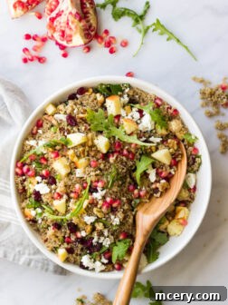 Pomegranate Arugula Quinoa Salad - most festive and delicious salad you will ever make! | littlebroken.com @littlebroken