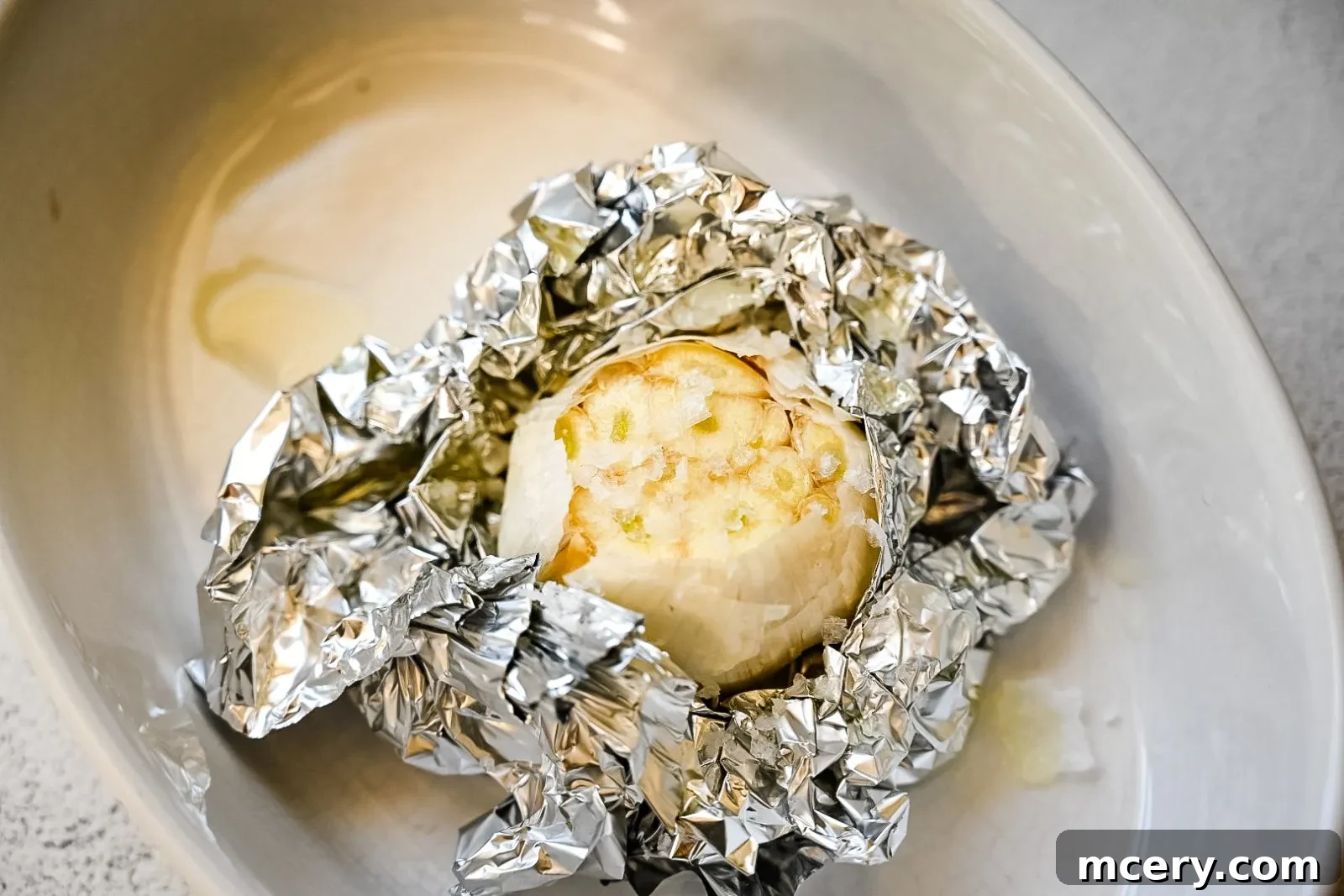 Golden Roasted Garlic Mash 4 A bowl of fresh, chopped thyme sprigs, ready for garnishing the mashed potatoes.