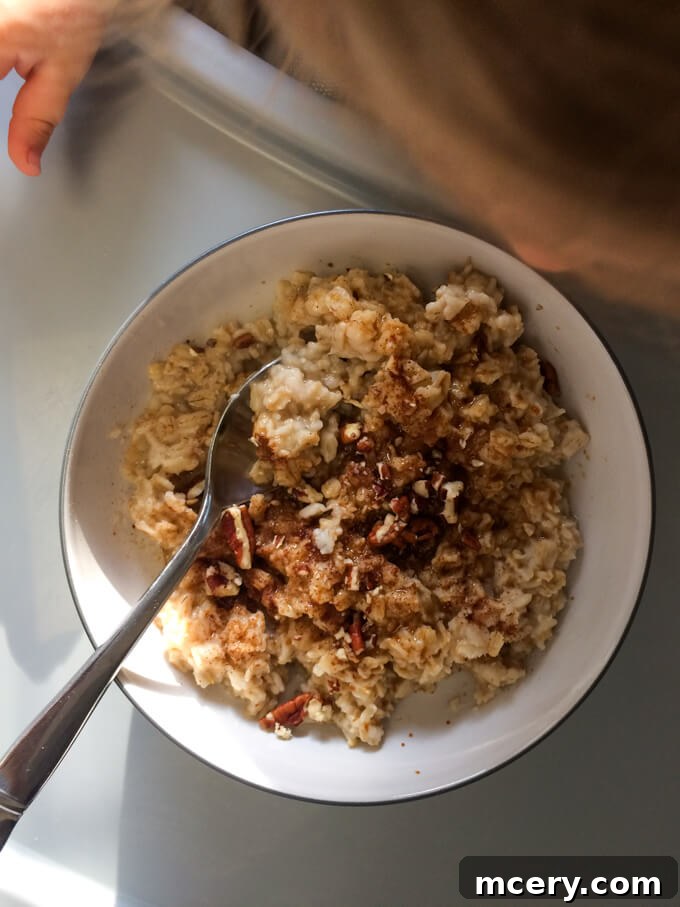 Little Miss A's oatmeal breakfast, topped with pecans, cinnamon, and a touch of coconut sugar.