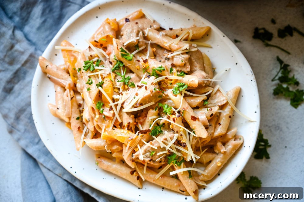 Bold One-Pot Cajun Chicken Pasta 4 One-Pot Cajun Chicken Pasta served in a bowl, garnished with fresh parsley.