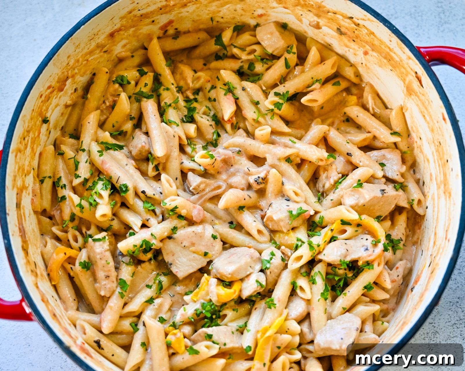 Bold One-Pot Cajun Chicken Pasta 8 One-Pot Cajun Chicken Pasta: Cream cheese melting into the pasta sauce, ready to serve.