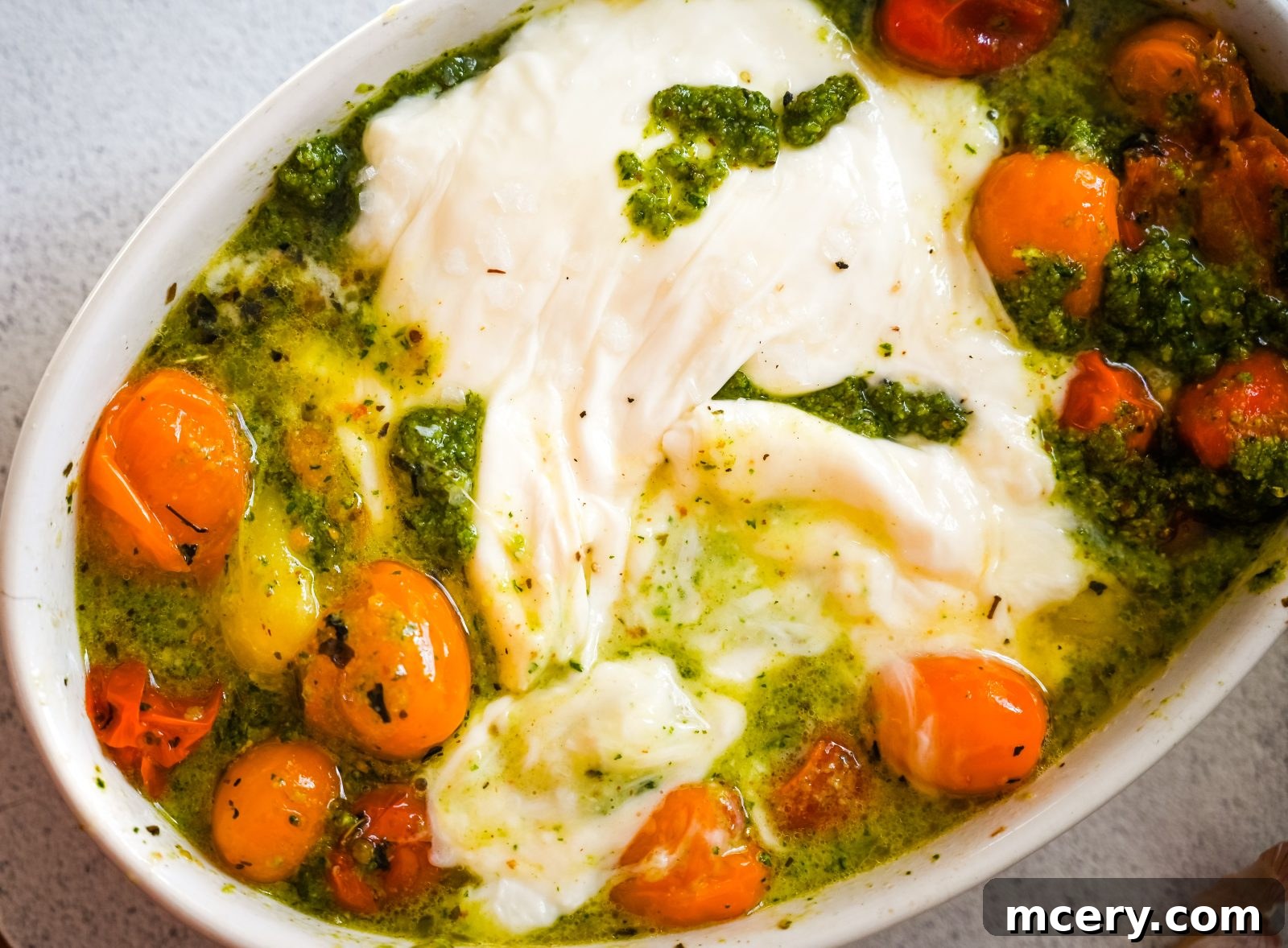 Velvet Burrata with Roasted Tomatoes and Fiery Pesto 2 Creamy Burrata with Roasted Tomatoes and Spicy Pesto, served with garlic toasts