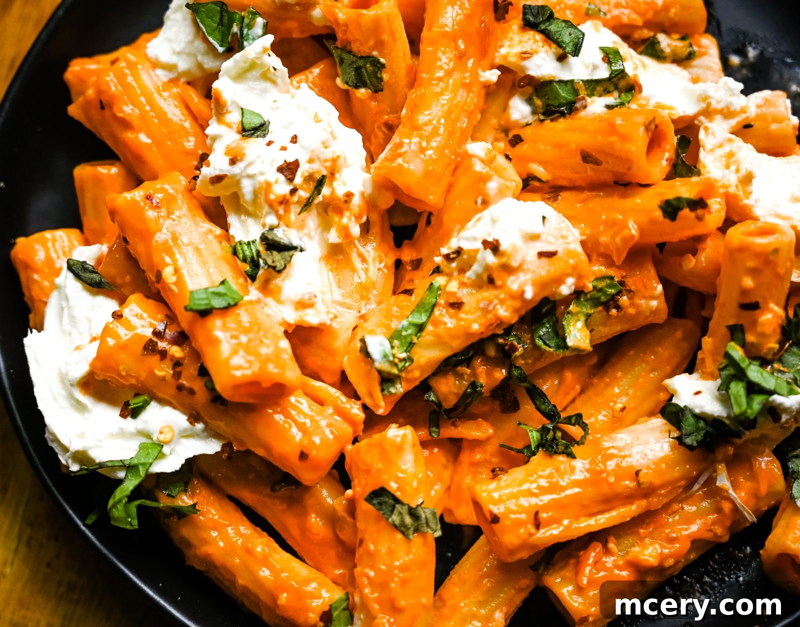 Gigi Hadid's Signature Spicy Vodka Pasta 12 Gigi Hadid Pasta in a bowl, garnished with fresh basil