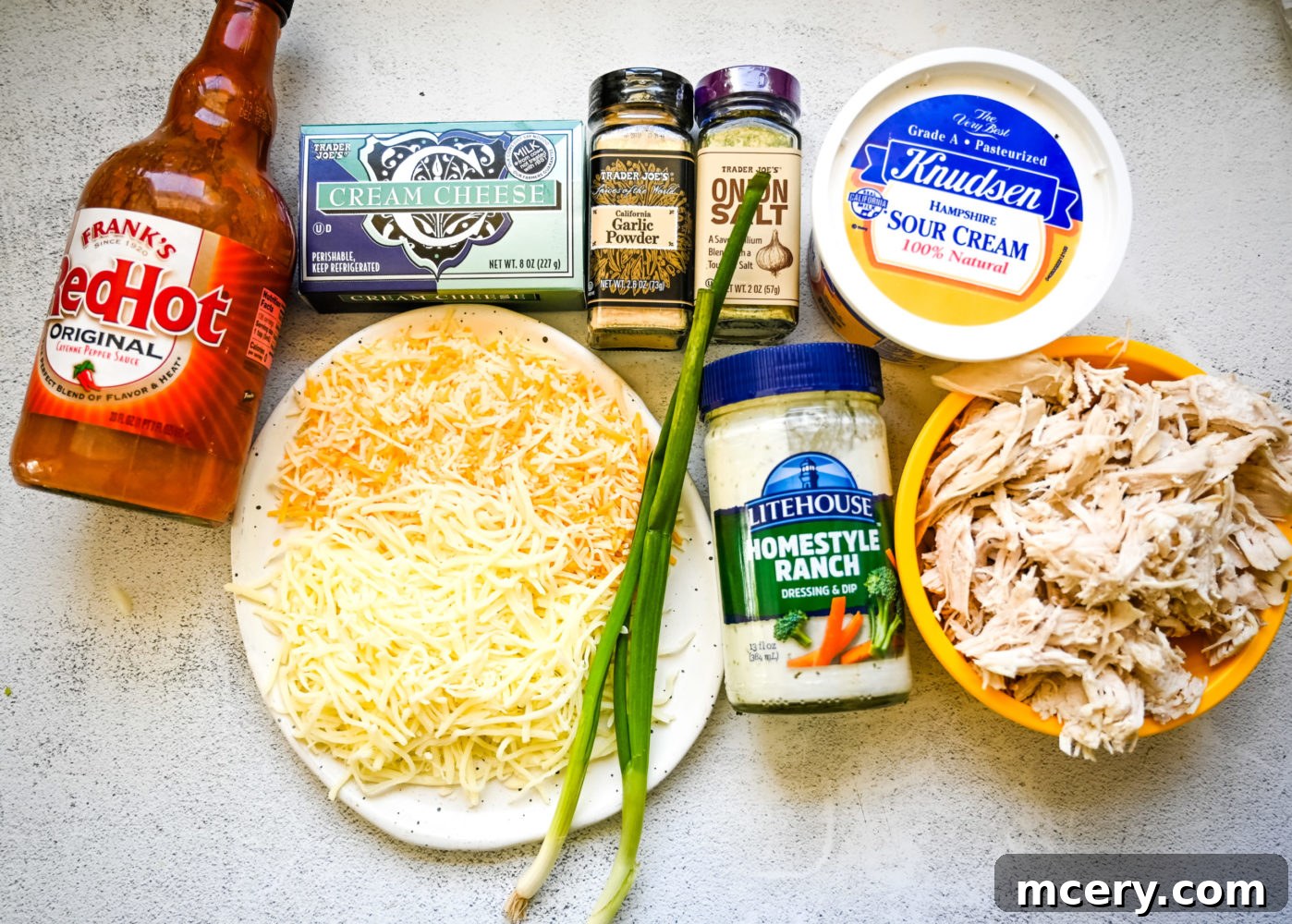 Ultimate Game Day Chicken Dip 4 Ingredients for Buffalo Chicken Dip laid out on a table.