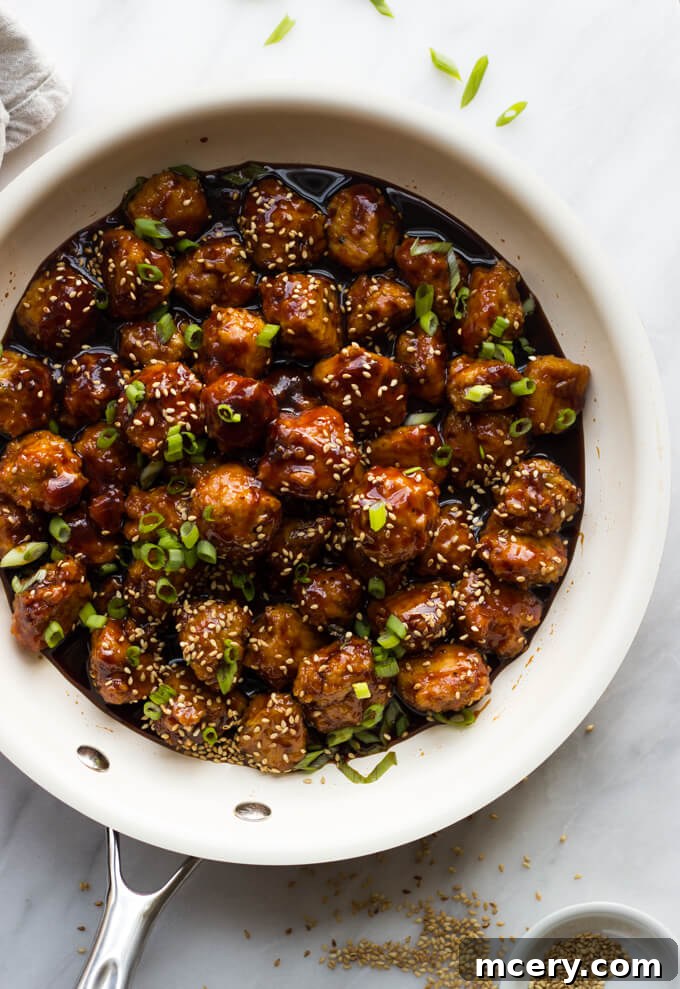 Sticky Asian Chicken Meatballs 7 asian chicken meatballs in sauce.