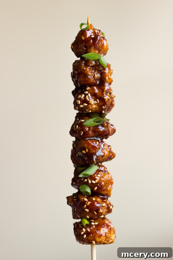 Sticky Asian Chicken Meatballs 8 mini chicken meatballs on a stick.
