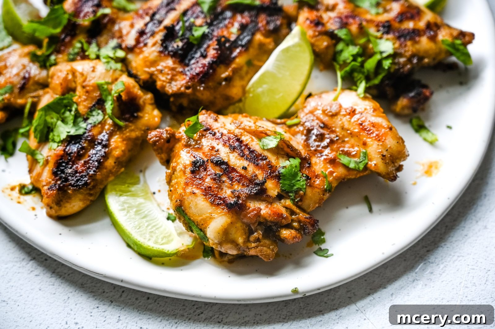 Chipotle-Style Chicken: Master the Flavor at Home 4 A vibrant display of fresh ingredients for Chipotle Chicken: cilantro, lime, and peppers, ready for preparation.