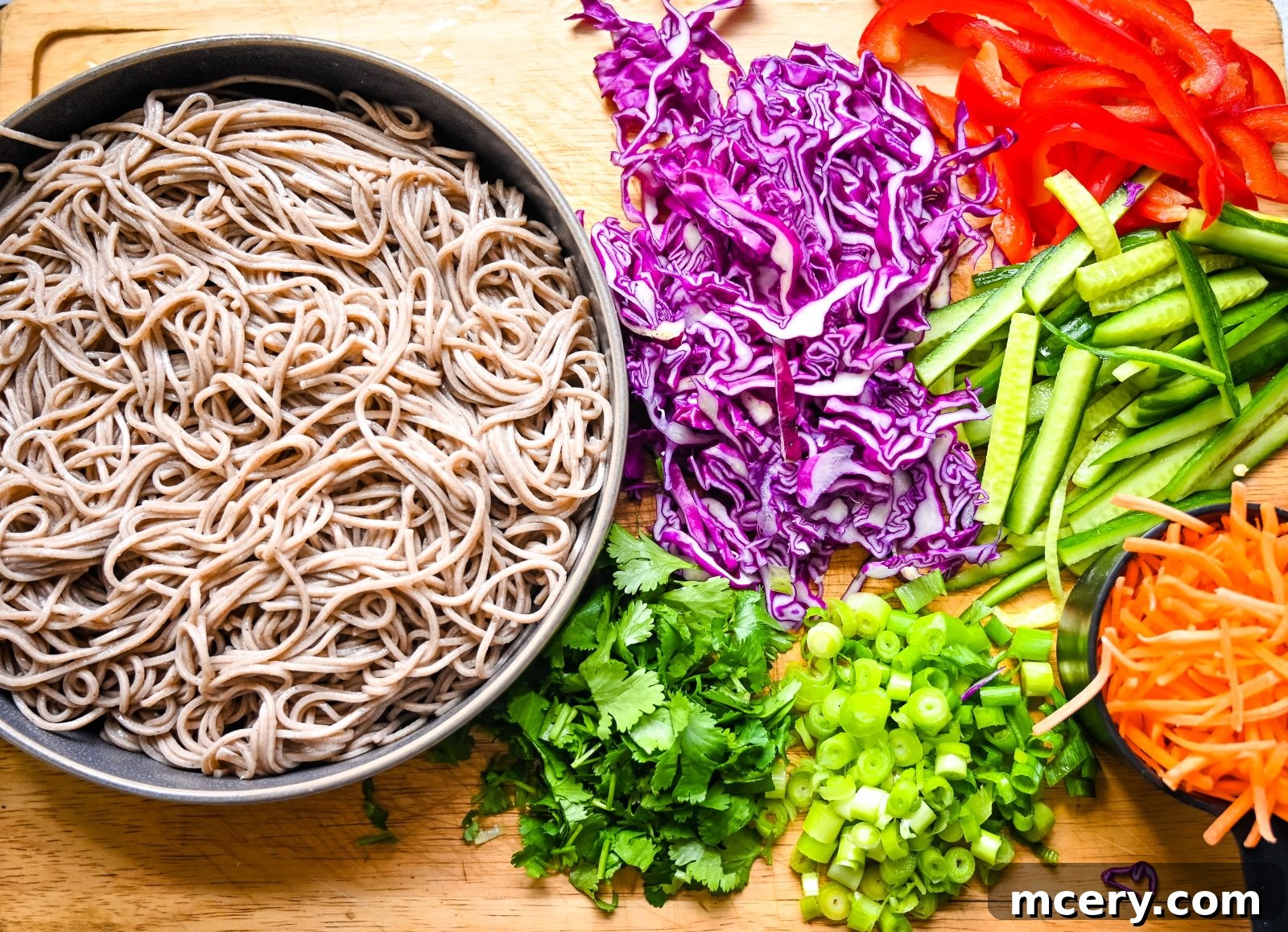 Zesty Peanut Soba Noodle Salad 4 A bowl of freshly made Soba Noodle Salad with Peanut Sauce, showing a generous portion of noodles and a variety of colorful chopped vegetables.