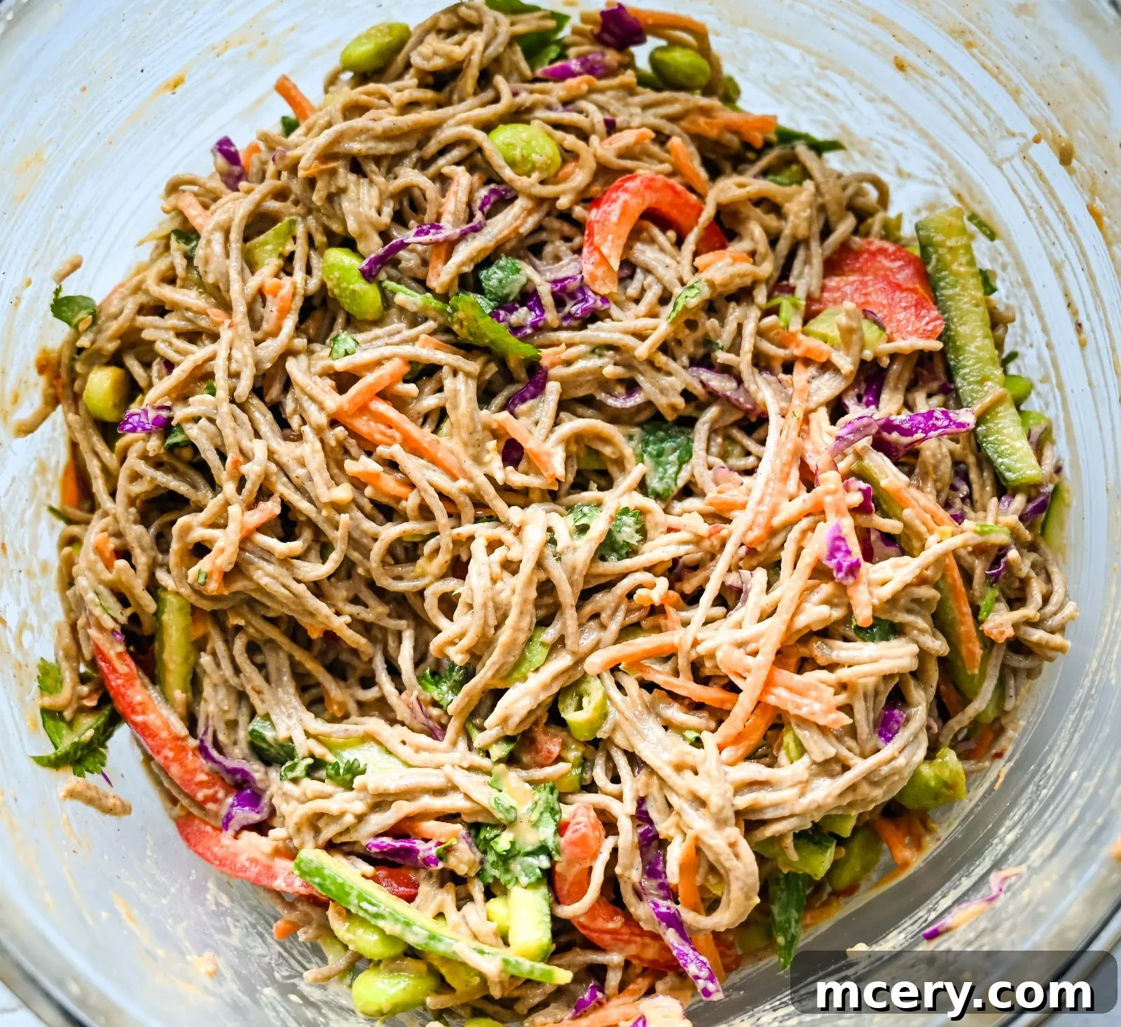 Zesty Peanut Soba Noodle Salad 8 A vibrant mix of fresh vegetables like shredded cabbage, carrots, bell peppers, and green onions, ready for the Soba Noodle Salad.
