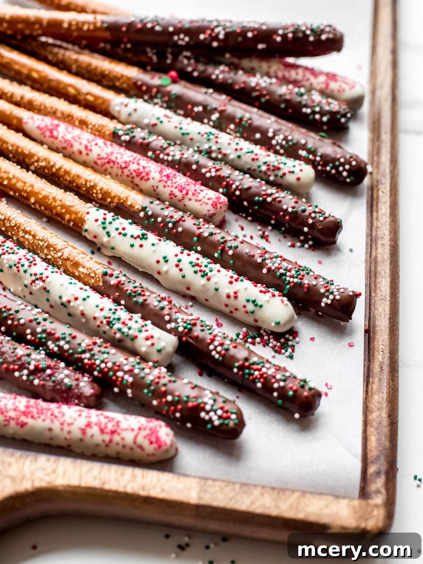Close-up of freshly dipped chocolate covered pretzels before decorating