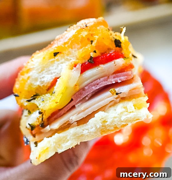 Italian Deli Sliders 2 Irresistible Italian Sandwich Sliders, golden brown and ready to serve, perfect for any gathering.
