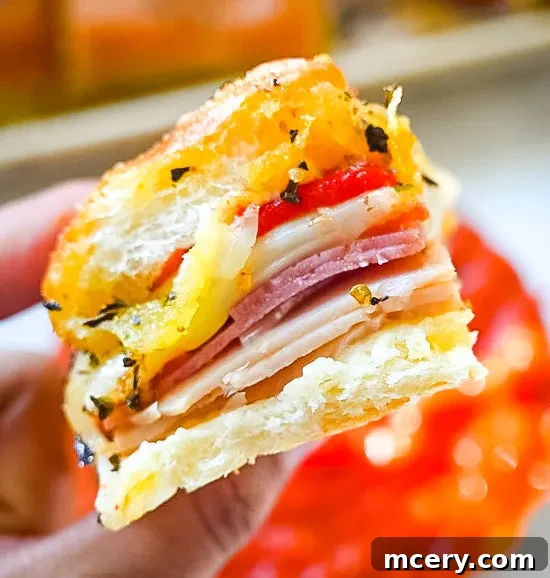 Italian Deli Sliders 7 Roasted red peppers sprinkled over the cheese layer of Italian Sandwich Sliders.