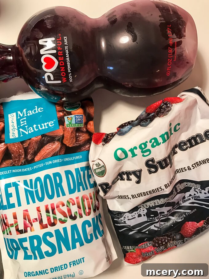 Vibrant berry smoothie blended with pomegranate juice and dates for a sweet and healthy afternoon pick-me-up.
