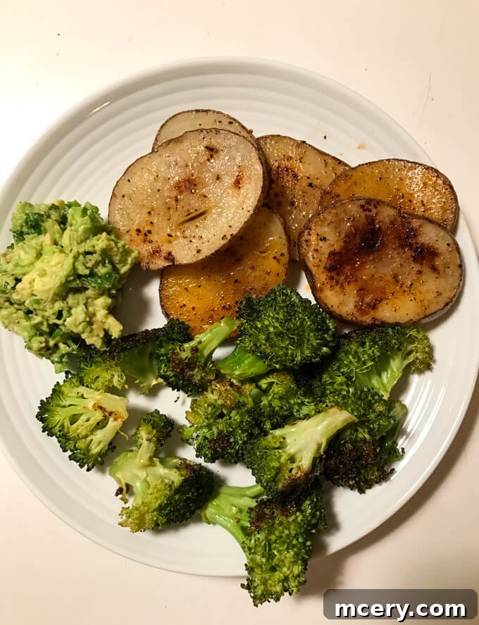 Wednesday Eats 4 8 Dinner featuring creatively flexible and easy meals: perfectly roasted broccoli and potato slices paired with a fresh, garlicky avocado mash. Explore the simple joy of roasted vegetables and a quick, flavorful side. | littlebroken.com @littlebroken