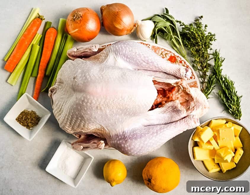 Skip the Brine! Your Easiest, Juiciest Thanksgiving Turkey Ever 3 A raw whole turkey is surrounded by fresh ingredients, including carrots, celery, onions, garlic, fresh herbs (rosemary, sage, parsley, and thyme), butter, lemons, and small bowls of salt and seasoning.