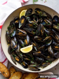 Steamed Mussels with Garlic and Parsley - only 8 ingredients to make the BEST tasting steamed mussels!