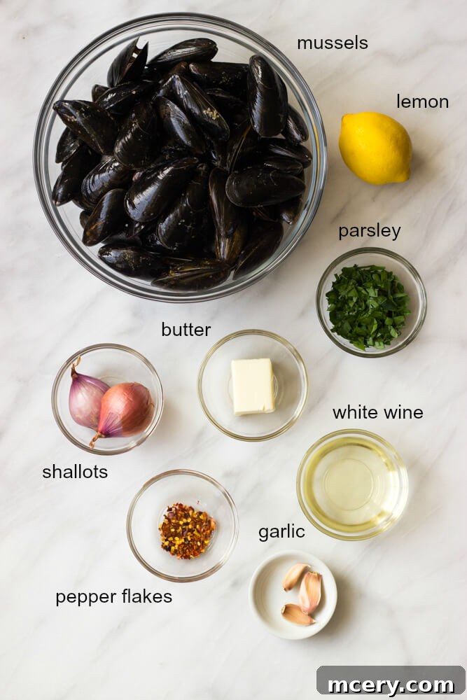 Zesty Garlic-Parsley Steamed Mussels 4 Ingredients laid out for steamed mussels: butter, shallots, garlic, red pepper flakes, wine, mussels, lemon, parsley.