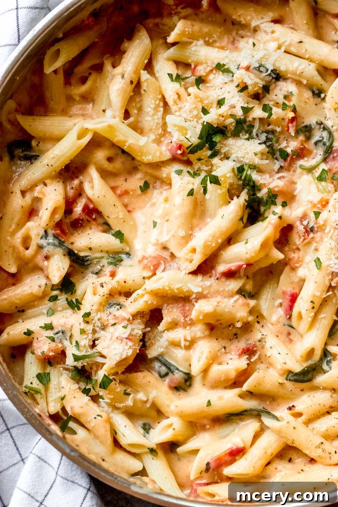 Easy summer pasta recipe made with fresh tomatoes, wholesome milk, spinach, and a medley of flavorful spices.