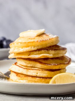 Ricotta cheese pancakes with fresh lemon juice, honey, and vanilla. These are so FLUFFY and good!