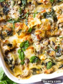 A perfectly baked slice of White Chicken Lasagna on a plate.