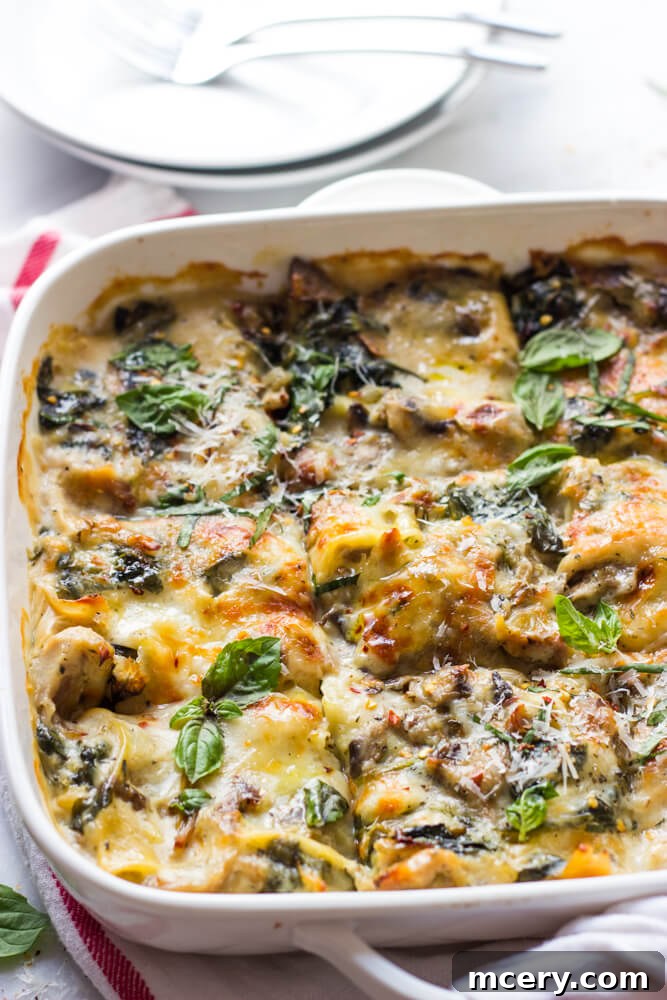 Creamy Chicken Lasagna with Spinach and Mushrooms 4 Perfectly layered Chicken Mushroom and Spinach Lasagna in a baking dish, ready for the oven.