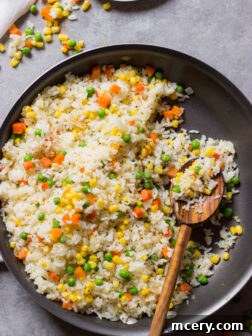 Mexican white rice with corn and peas, a vibrant and appealing side dish.