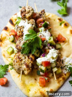Chicken Gyros - the BEST chicken gyros served with simple cucumber tomato salad and creamy tzatziki sauce