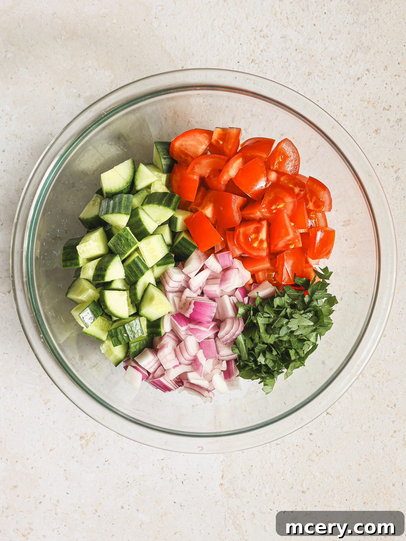 Homemade Chicken Gyro Perfection 6 Diced tomatoes, cucumbers, onions, and parsley in a bowl for salad.