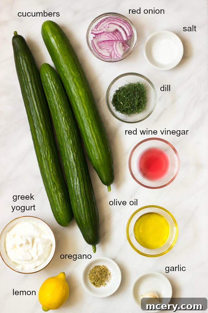 Refreshing Greek Cucumber Salad 3 Ingredients for Greek yogurt cucumber salad laid out on a table
