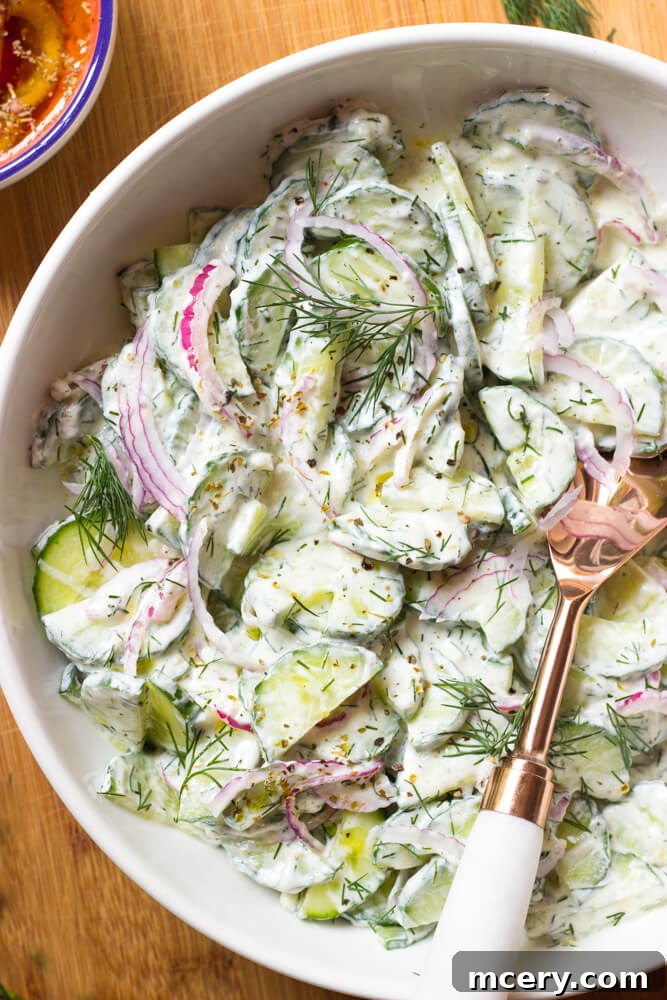 Refreshing Greek Cucumber Salad 4 Cucumber yogurt salad with Greek yogurt dressing and marinated onions, ready to serve