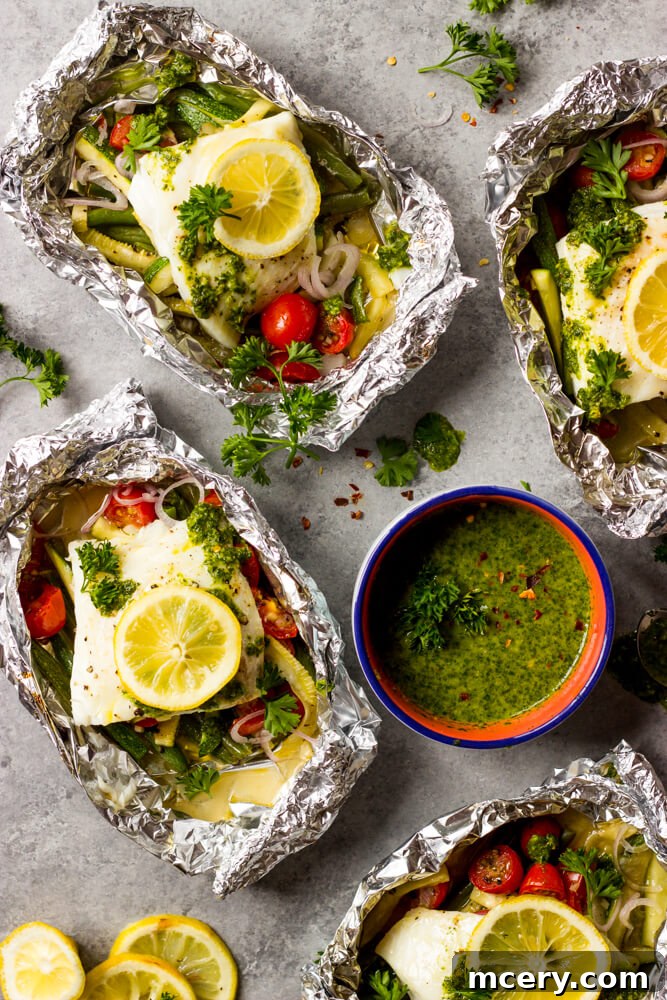 Flavorful Foil-Wrapped Fish 6 Baked Fish and Vegetables in Foil with Chimichurri Sauce served on a plate
