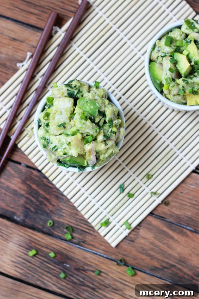 Ina Garten's fresh tuna salad, rich with avocado, served beautifully in a white bowl.