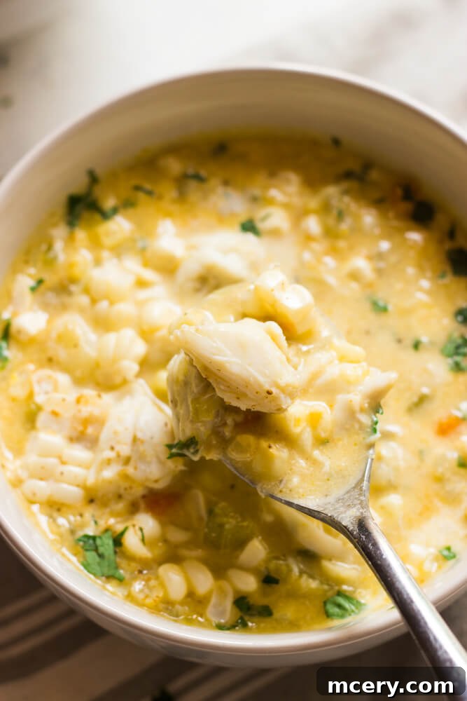 Sweet Corn and Crab Chowder 5 Close-up of a bowl of creamy crab chowder, showing the textures of crab meat and corn
