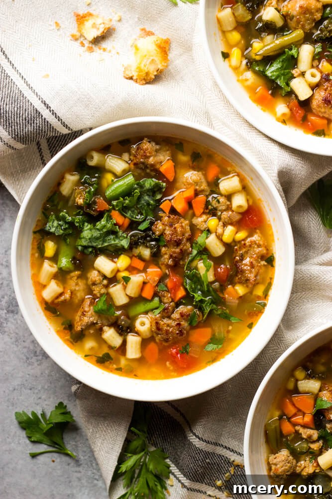 Hearty Italian Sausage and Kale Soup 5 close up sausage and kale soup in white bowl