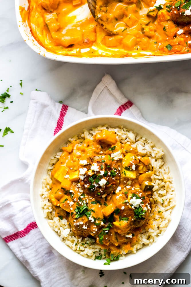 Hearty Turkey Meatballs in Rich Sauce 7 Baked turkey meatballs in roasted pepper sauce with fresh parsley garnish.