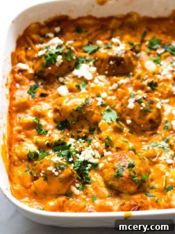 Turkey Meatballs in Roasted Pepper Sauce - made with no cream or cheese, this roasted pepper sauce is made with cashews then baked with healthy turkey meatballs and simple veggie hash | littlebroken.com