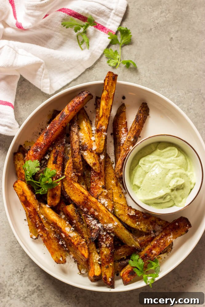 Golden Baked Fries with Zesty Avocado Dip 2 Crispy Baked Potato Fries with Creamy Cilantro-Lime Avocado Dip - a perfect homemade side dish recipe