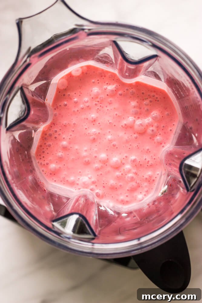 Strawberry Yogurt Sunshine Pops 3 Pureed strawberries in a blender, ready for mixing