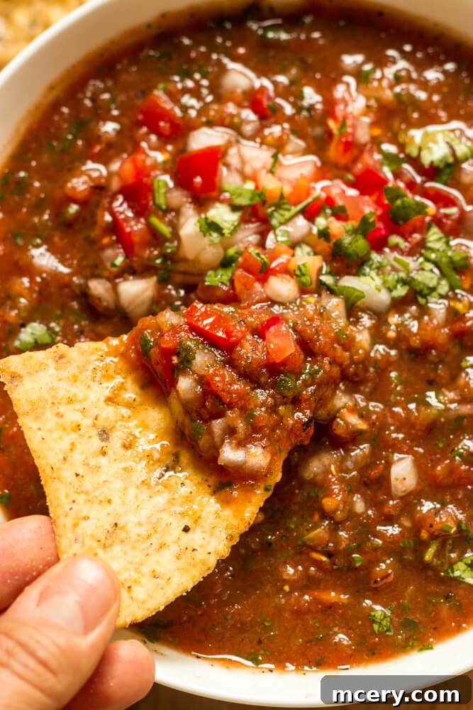 Smoky Roasted Tomato Salsa 2 close up of roasted tomato salsa in white bowl