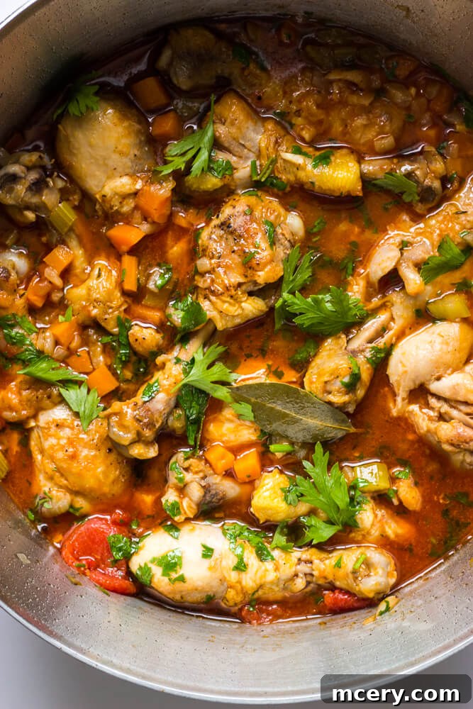 Simple Weeknight Chicken Cacciatore 10 close up cooked chicken drumsticks in sauce.