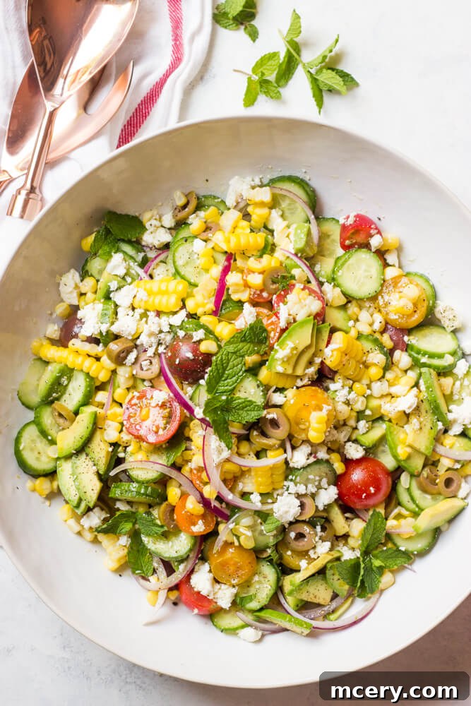 Vibrant Greek Corn Salad 2 Vibrant Greek Corn Salad with creamy avocado, fresh vegetables, and feta cheese, a perfect summer side dish. | littlebroken.com