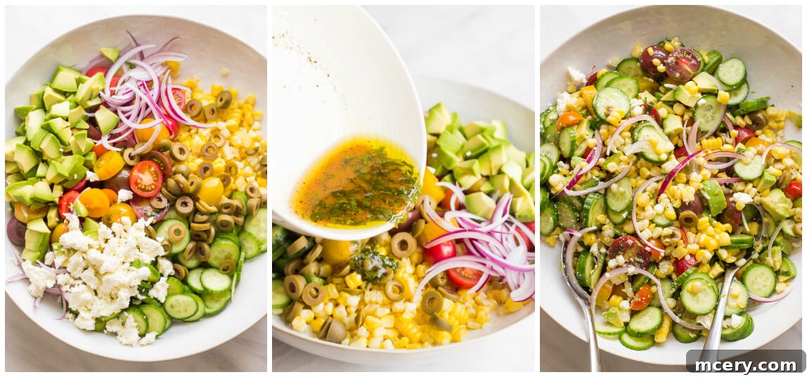Vibrant Greek Corn Salad 5 Image showing all Greek Corn Salad ingredients tossed together in a large bowl, ready to serve. | littlebroken.com