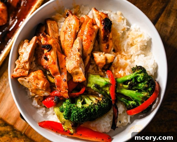 Honey garlic chicken thighs over rice with veggies