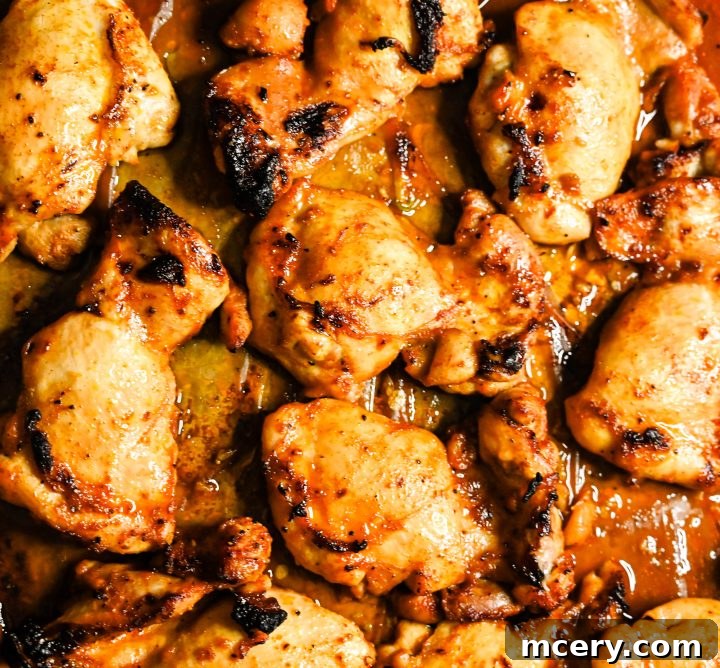Honey garlic chicken on a plate with fresh parsley