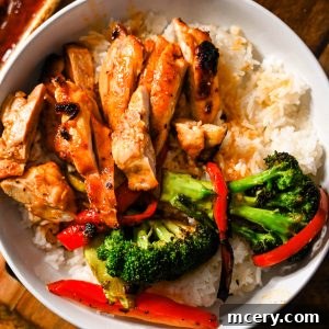 Honey garlic chicken thighs over rice with veggies