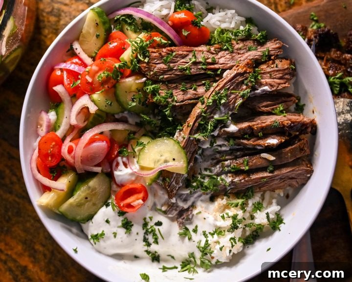 Zesty Mediterranean Steak and Rice Bowls with Garlic Dill Yogurt Sauce 2 Delicious Mediterranean steak and rice bowls with a vibrant garlic dill yogurt sauce, perfect for athletes