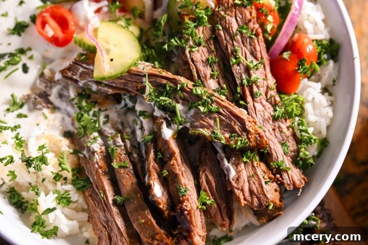 Zesty Mediterranean Steak and Rice Bowls with Garlic Dill Yogurt Sauce 6 Overhead shot of two Mediterranean steak and rice bowls ready to be enjoyed by athletes or a family