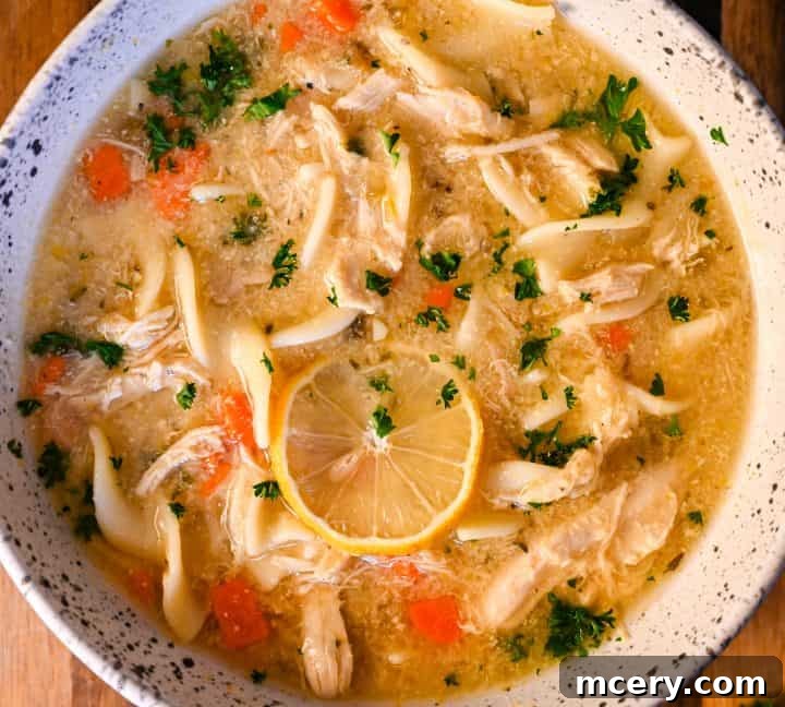 High protein chicken noodle soup with fresh parsley, perfect for athlete recovery